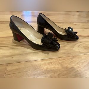 Christian Louboutin "Carmela" pumps.